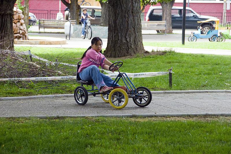 20071218 110059 D2X 4200x2800.jpg - Youngster drives this vehicle, on rental basis, central square, Coyhaique, Chile